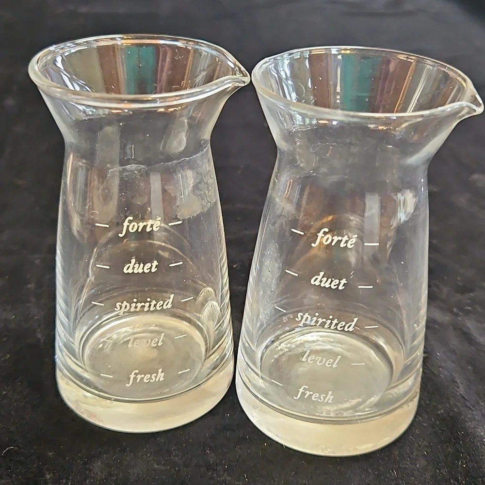 Set of 2 mini decanter or small measuring glass likely for wine or other liquids